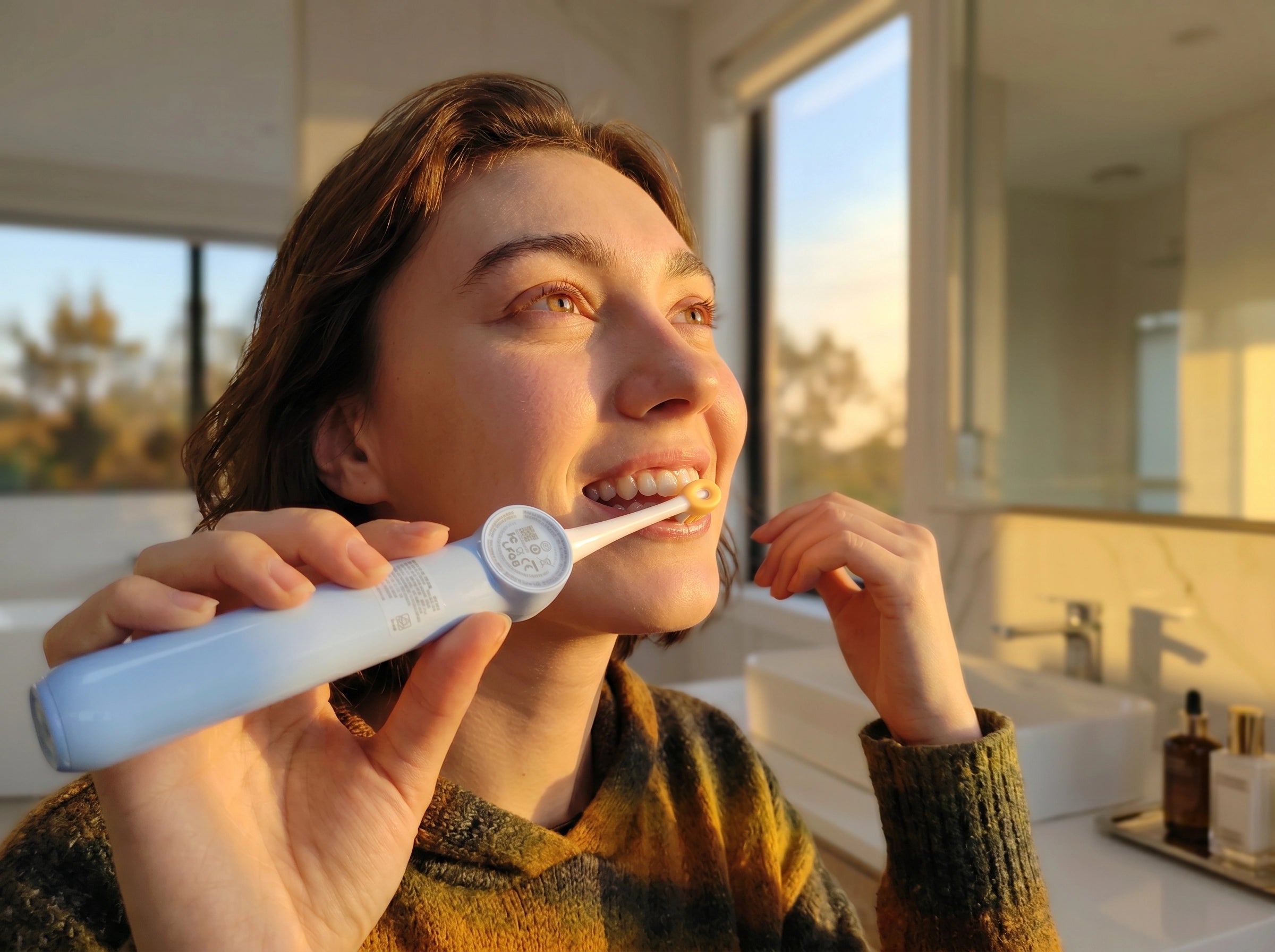 A woman holding an arijet x5 with a smile